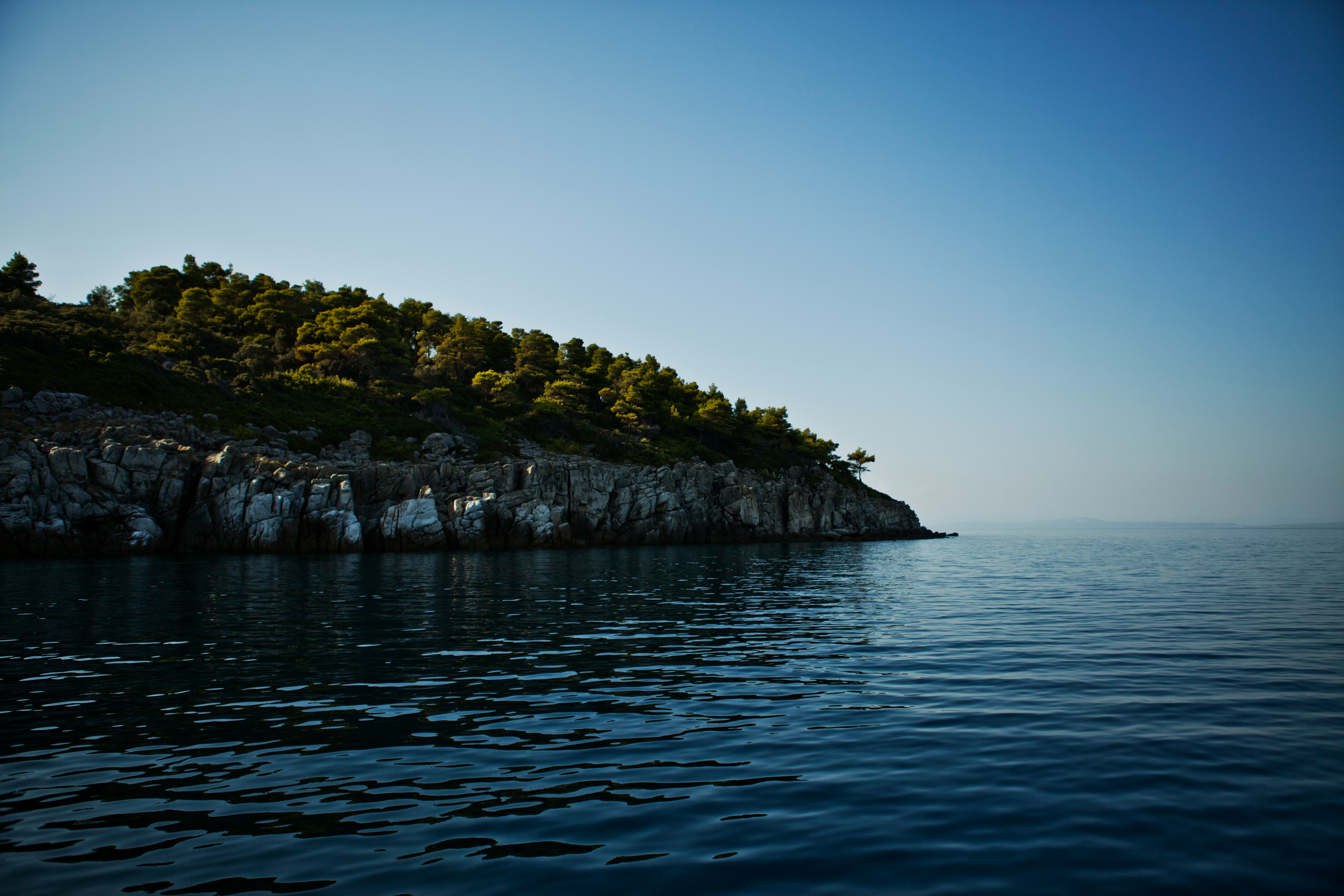 body of water near mountain